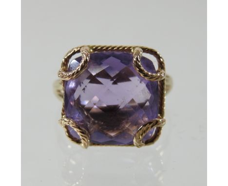 A large 9 carat gold amethyst ring, boxed