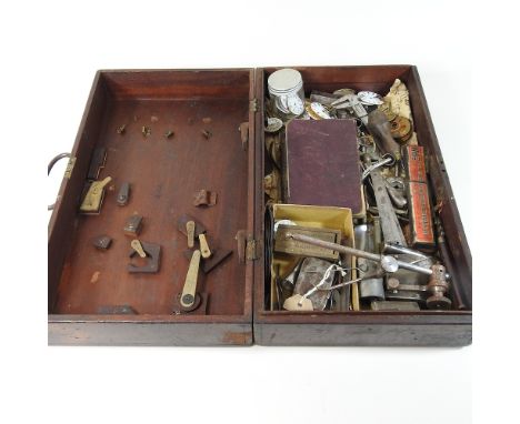A collection of watchmaker's and other tools, in a wooden box