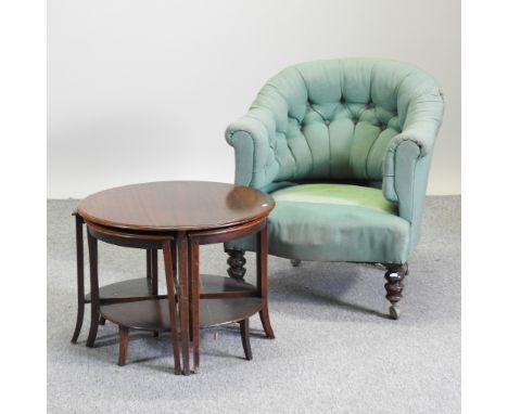 A Victorian green upholstered button back tub chair, together with a nest of five circular occasional tables (2)