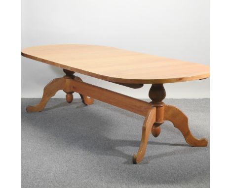 A very large light oak twin pillar dining table, 150 x 123cm 