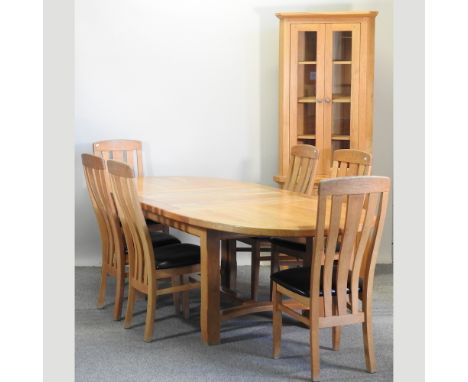 A modern light oak extending dining table, with two additional leaves, 270 x 110cm overall, together with six matching chairs