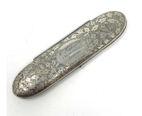 A VICTORIAN SILVER SPECTACLES CASE AND A PAIR OF SILVER SPECTACLES the elongated oval case bright-cut with trailing ivy surro