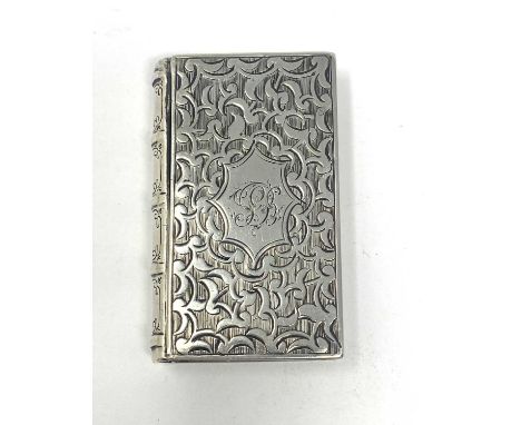 A VICTORIAN SILVER VESTA CASE, CHARLES WASHINGTON SHIRLEY DEAKIN, BIRMINGHAM, 1858 realistically modelled as a book, the fron