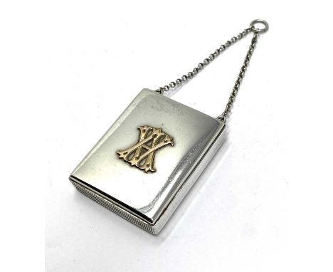 A VICTORIAN SILVER VESTA CASE, THOMAS JOHNSON, LONDON, 1867 rectangular, the lid applied with a gilt A monogram and opening b