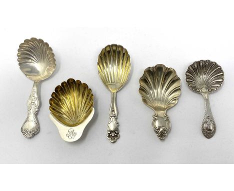 FIVE VICTORIAN SILVER CADDY SPOONS all with various 'shell' bowls: one with short feather-edge handle with a crested cartouch