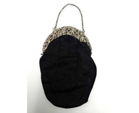 A VICTORIAN SILVER BAG MOUNT, BROWNETT & CO., LONDON, 1890 the crescent shaped hinged mount openworked with putti and birds a