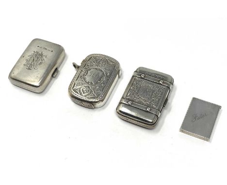 FOUR VICTORIAN SILVER VESTA CASES, STOKES & IRELAND, BIRMINGHAM, 1880-1883 one in the form of a trunk or case, one side engra