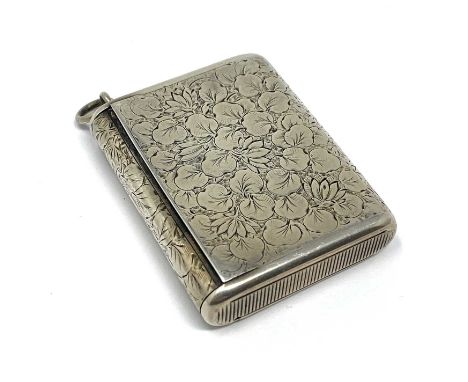 A VICTORIAN SILVER PATENT VESTA CASE, ELKINGTON & CO. OVERSTRIKING ANOTHER, LONDON, 1879 oblong, covered in foliate engraving