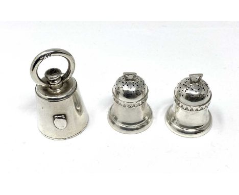 A PAIR OF VICTORIAN SILVER 'BELL WEIGHT' PEPPERETTES AND A PEPPER GRINDER, LONDON, 1885 / 86 RESPECTIVELY the plain pepperett