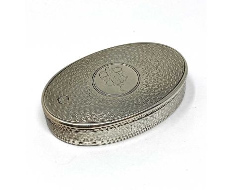 A VICTORIAN SILVER VESTA CASE, H.W. & L. DEE, LONDON, 1873 oval, with concentric engine-turning and engraved with a coat of a