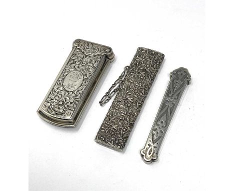 A VICTORIAN SILVER NEEDLE SELECTOR CASE AND TWO SILVER BODKIN CASES the oblong selector case with hinged top, with scroll fol