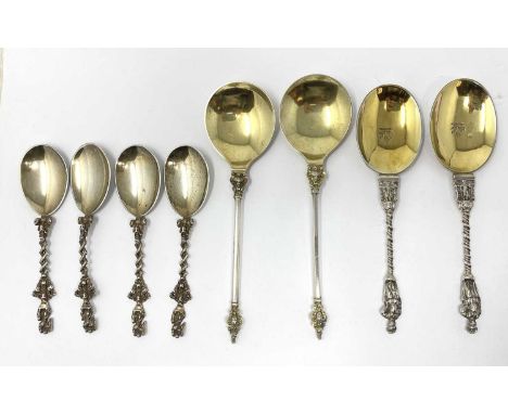 A GROUP OF EIGHT VICTORIAN SILVER DECORATIVE SPOONS, ALL LONDON all with gilt bowls, comprising: a set of four with ovate bow