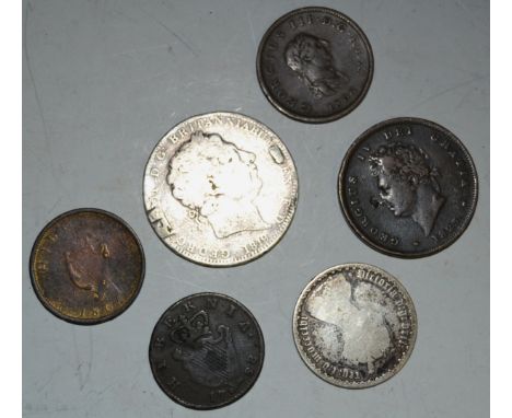 Coins - a George III silver crown dated 1819; a circulated Victorian Gothic florin, date 1856; a George III Irish half penny 