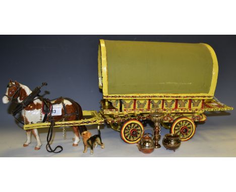 A scratch built Horse drawn roll top gypsy caravan, hand painted throughout with mini copper pan accessories; a ceramic dog c