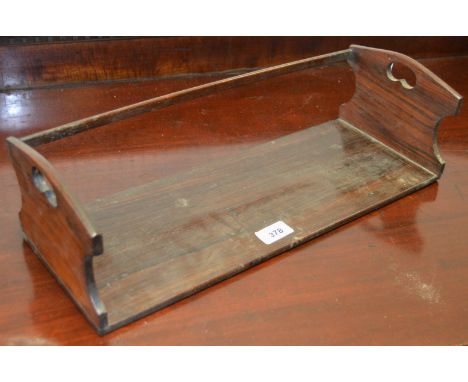 A early 20th century rosewood book trough