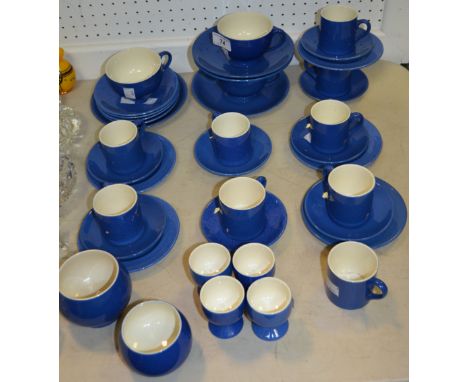 A Moorcroft powder blue part tea setting for five, conforming pair of sugar bowls, eight coffee cups, saucers and side plates