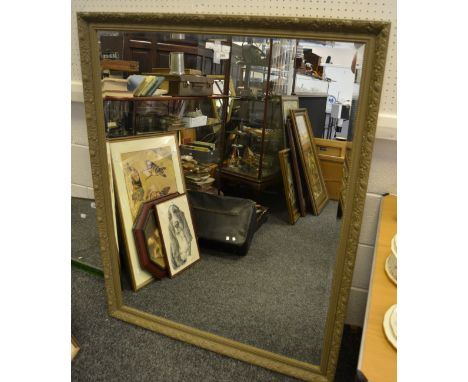 A substantial mirror, frame decorated in scrolling floral motifs
