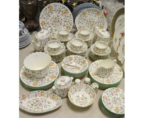 A comprehensive Minton Haddon Hall pattern tea and dinner service comprising of teapots, bread and butter plate, cups, saucer