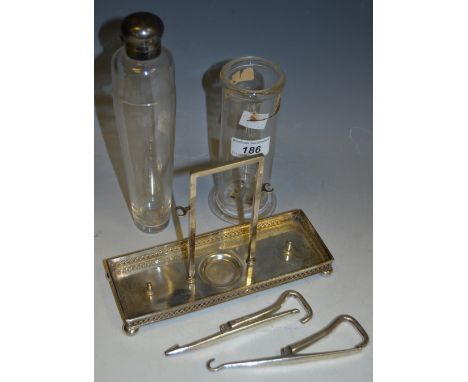 A silver dressing table tray by JD & S, hallmarked Sheffield; silver coloured metal mounted stirrup flask; a near pair of ste