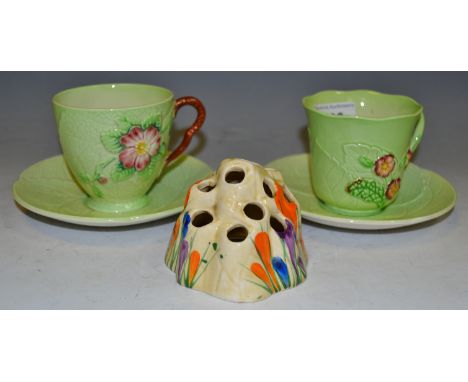 Ceramics - a Clarice Cliff Crocus pattern hat pin stand; a pair of Carltonware strawberry rose pattern cups and saucers (3)