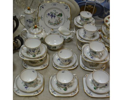 A Tuscan Plant tea service for twelve including tea pot, water jug, cake plates; etc