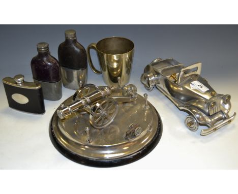 A table canon; a hip flask; others; etc qty