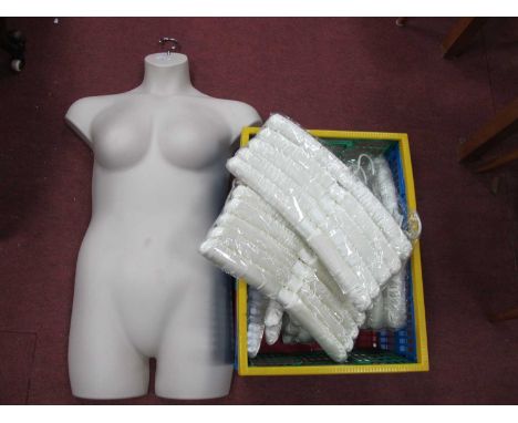 Dunelm Plush Cream Coat Hangers; together with a plastic hanging mannequin.