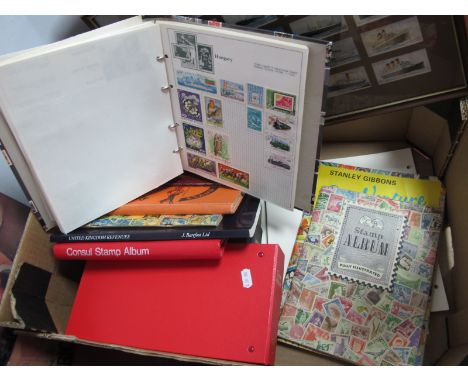Stamp Albums, two albums of First Day Covers, framed Wills cigarette cards, Merchant Ships of The World:- One Box