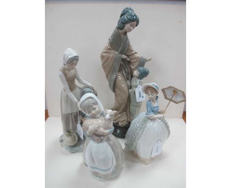 A Group of Four Nao Figurines - Girl holding a lamb, lady holding a parasol etc.