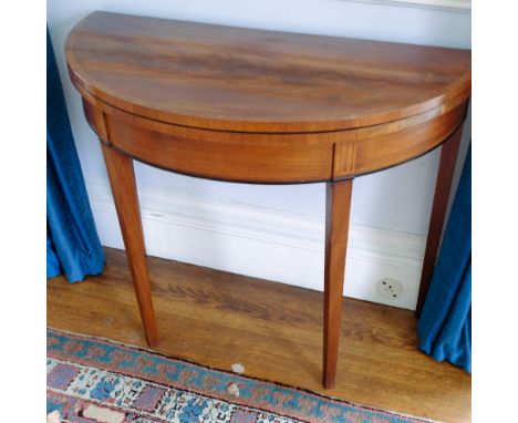 MAHOGANY AND CROSS BANDED DEMI LUNE CARD TABLE ON SQUARE TAPERED LEGS