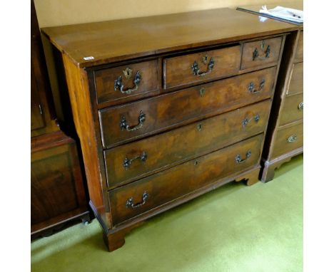GEORGIAN MAHOGANY AND WALNUT VENEERED CHEST OF 3 PLUS 3 DRAWERS ON BRACKET FEET