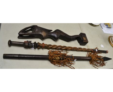 Tribal Art - a carved spiralling walking stick/club; a carved fertility goddess; a leather mounted spear (3)
