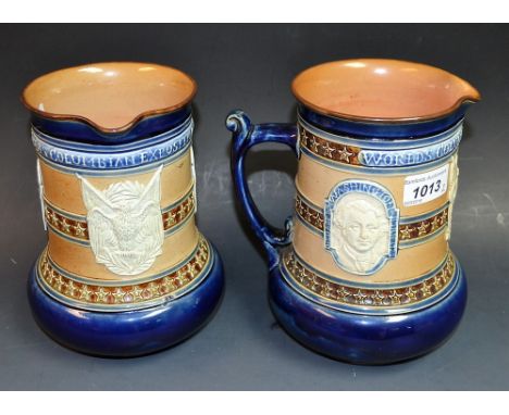 A pair of late Victorian Doulton Lambeth salt glazed stoneware cylindrical jug, Worlds Columbian Exposition 1893, sprigged wi