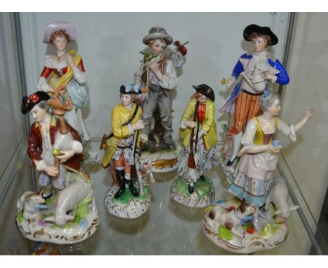 A pair of Sitzendorf figures; a pair of Dresden figures; an Italian figure; others (7)