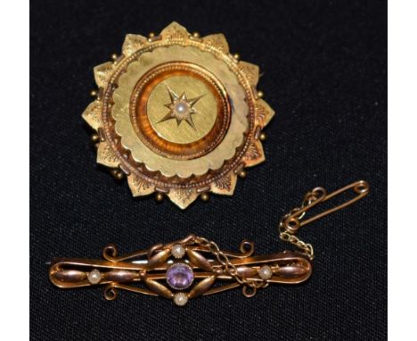A 9ct gold bar brooch, seed pearl and amethyst set; a yellow metal locket brooch, split seed pearl at centre