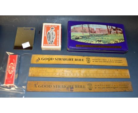 Advertising - a 1950s dummy Kit-Kat chocolate bar; a Cadburys Bournville tin; a Butlins badge; three CWS Goods at the Co-Oper