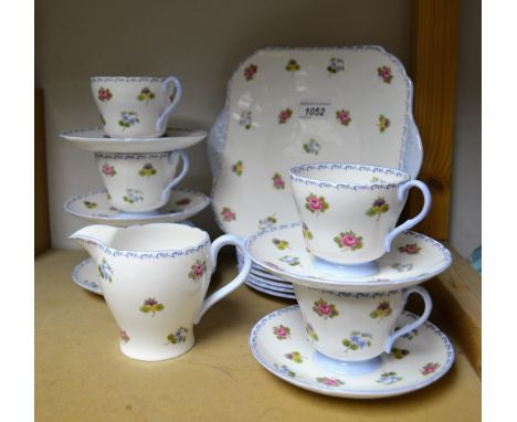 Ceramics - a Shelley tea service, floral pattern on a white ground, comprising bread and butter plate, five cups, five saucer