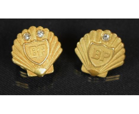 A 9ct gold BP long service lapel pin, two diamonds; another similar with single diamond, total gross weight approx 9grams 