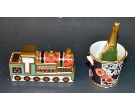 A Royal Crown Derby Treasures of Childhood Steam Train, first quality, boxed; a Royal Crown Derby miniature champagne bottle 