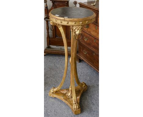 A gilt wood jardiniere stand, 19th Century with lions mask ring side mounts and lion paw feetMoulding around the top with a c