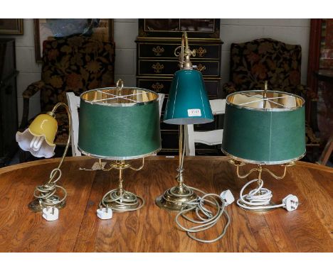 A pair of brass table lamps with green shades, a single adjustable brass table lamp with green glass shade, and another simil