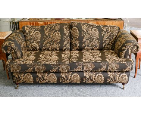 A modern upholstered scroll arm sofa