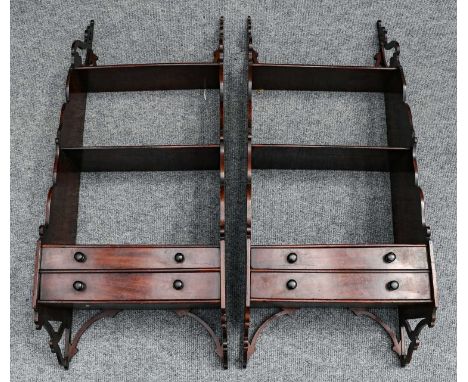 A pair of 19th century mahogany three tier hanging open shelves each fitted with a pair of base drawers, 39cm by 25cm by 98cm