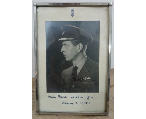 King George VI, an autographed photographic portrait, inscribed 'With Best Wishes for Xmas &amp; 1941' to margin, glazed and 