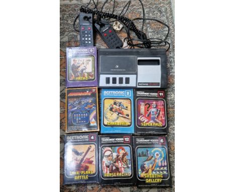 An Acetronic mpu 2000 console with assorted boxed games