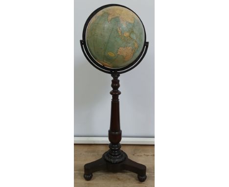 A good 12" terrestrial globe by George F Cram, 12" globe, cast iron axis, turned mahogany pedestal with triform platform base