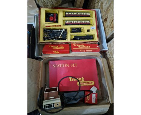 A Triang model train set including loco, together with a box of accessories.