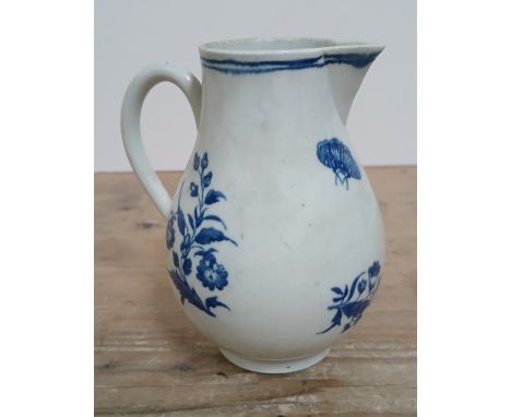 A first period Worcester porcelain sparrow beak jug, circa 1770, decorated in blue and white with flowers and a butterfly, bl