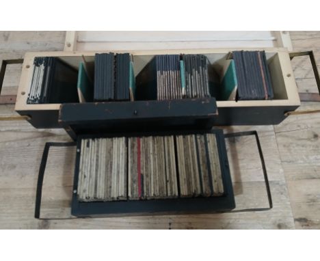 Two boxes of assorted magic lantern slides to include war, advertising &amp; story sets etc.