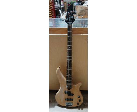 A Yamaha 4-string electric bass guitar.